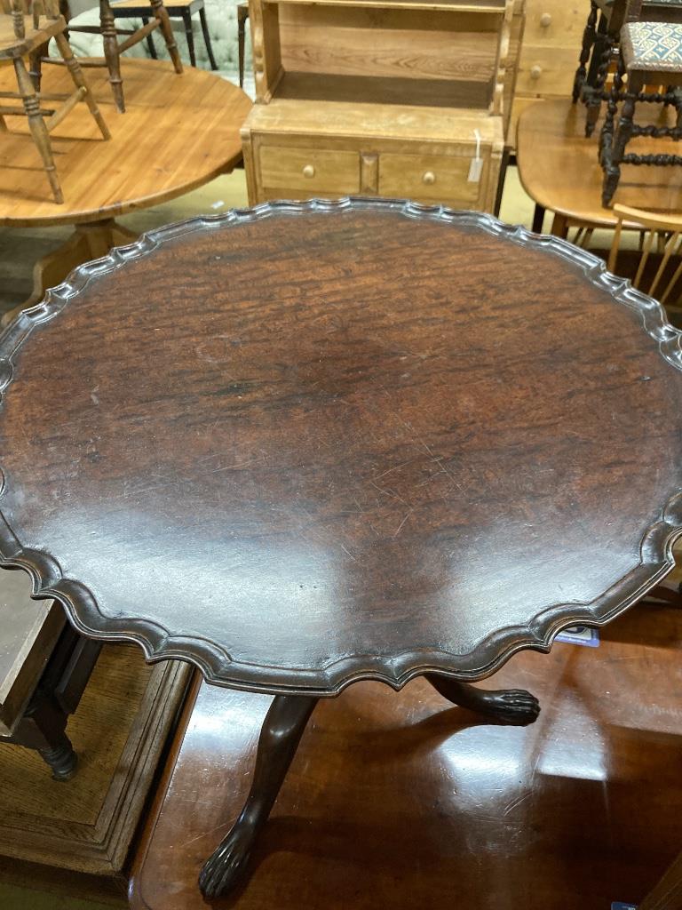 A George III style mahogany circular tripod table (later carved), 73cm diameter, height 70cm